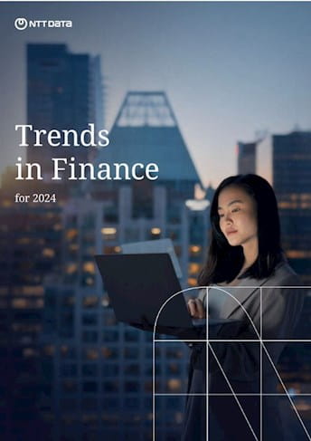 a woman on a laptop with the words trends in finance for 2020