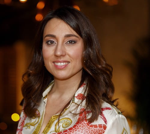 a woman in a floral shirt