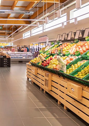 a supermarket with a lot of fruit and vegetables
