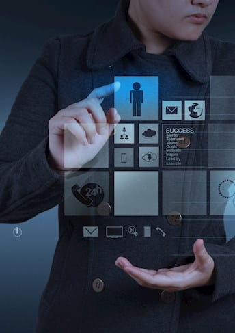 Success Story BMW Group Sites - A man is operating a futuristic touchscreen