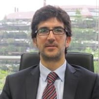 a man in a suit sitting at a desk