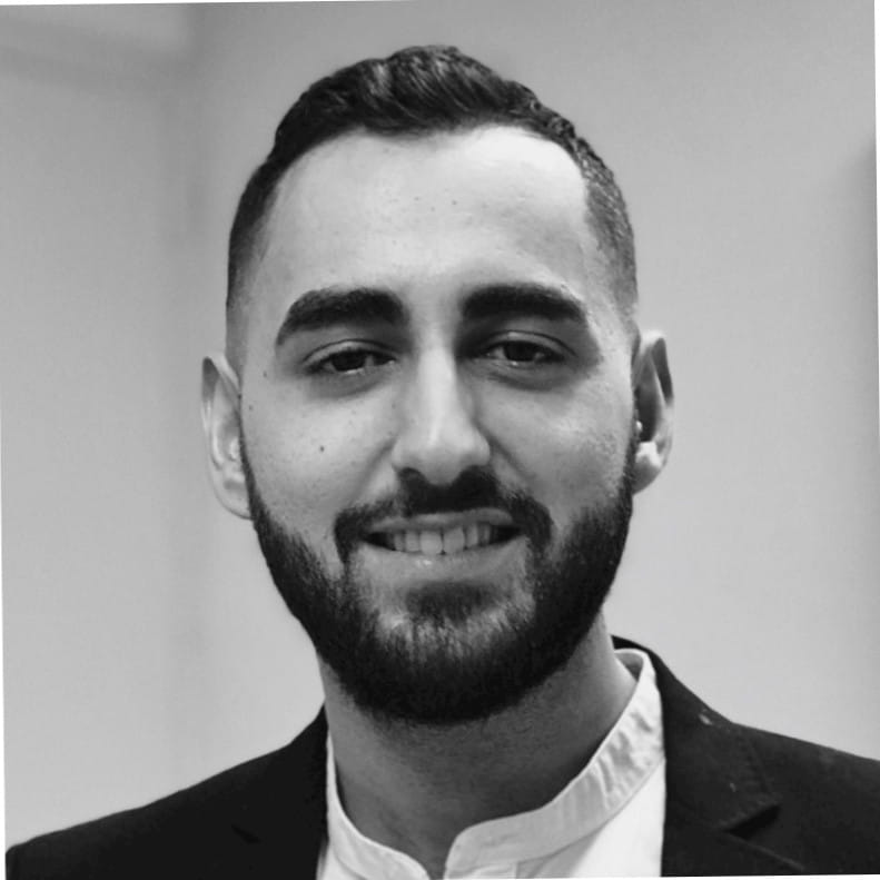 a black and white photo of a man with a beard