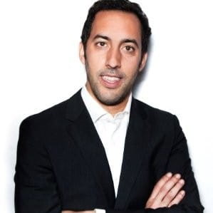 a man in a suit with his arms crossed