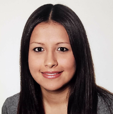 a woman in a gray shirt with long hair