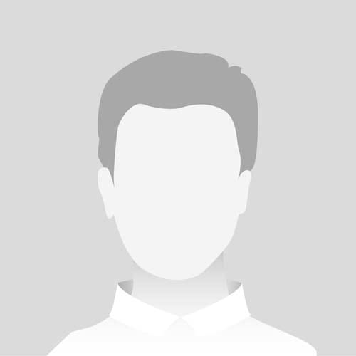 a man in a white shirt with a grey background