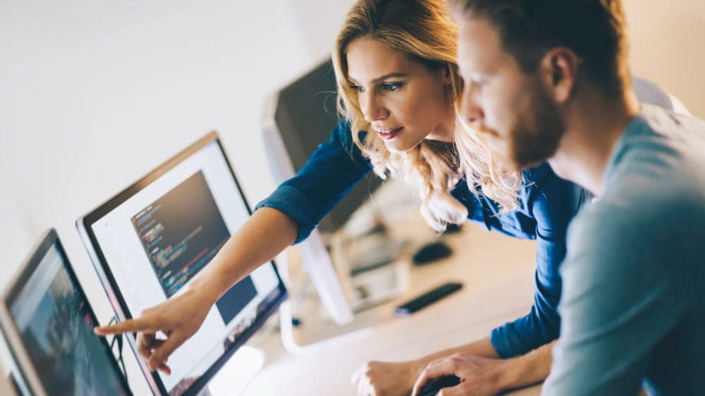 two people looking at a computer screen