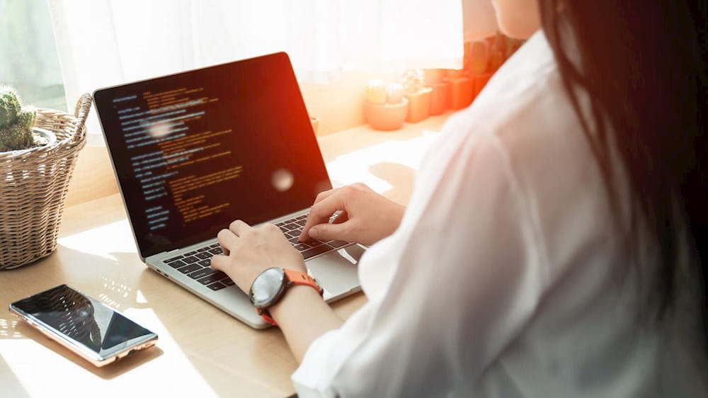 a woman working on a laptop