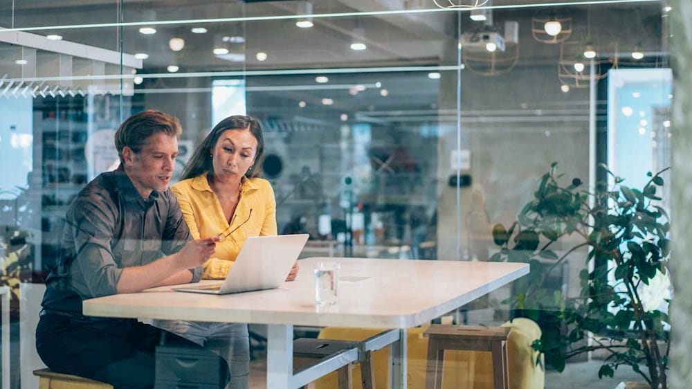 Colleagues talking at work