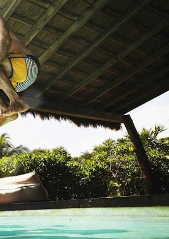 People diving in a swimming pool