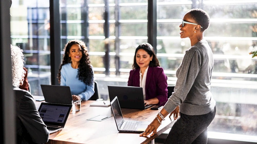 People sitting at a table in an office