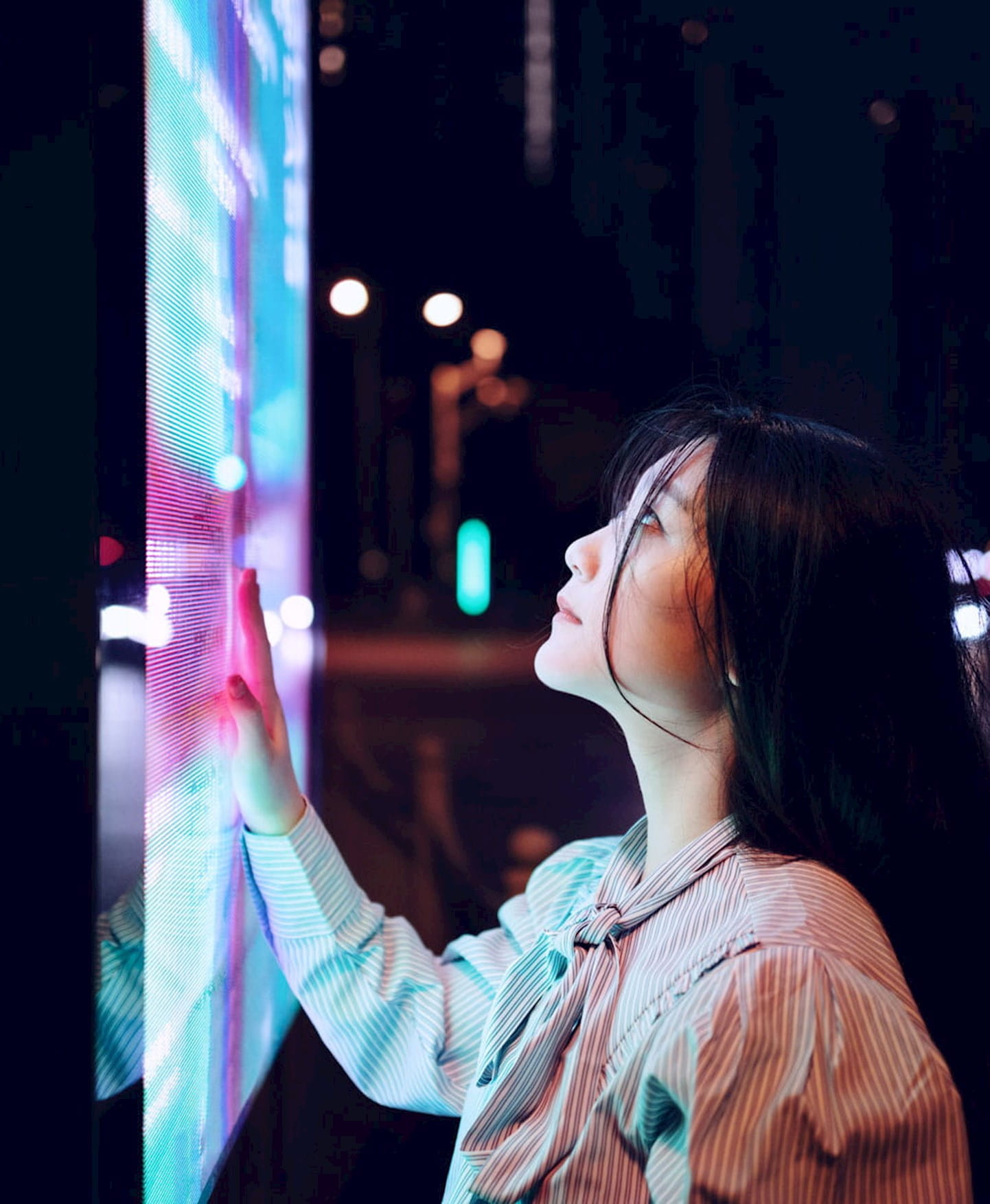 Woman looking at large screen