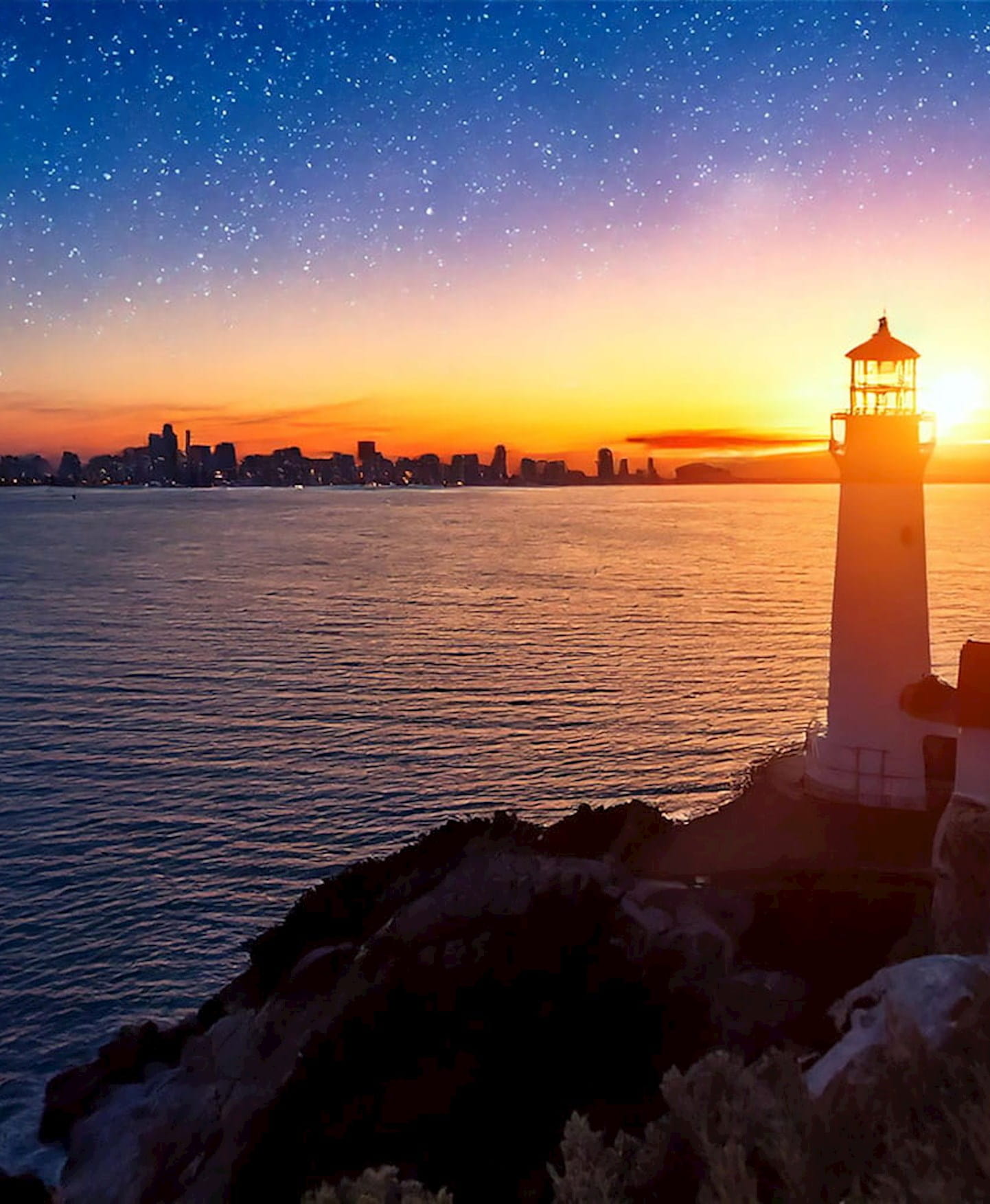 Lighthouse by the sea at dawn