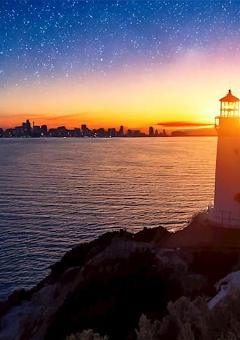 Lighthouse by the sea at dawn