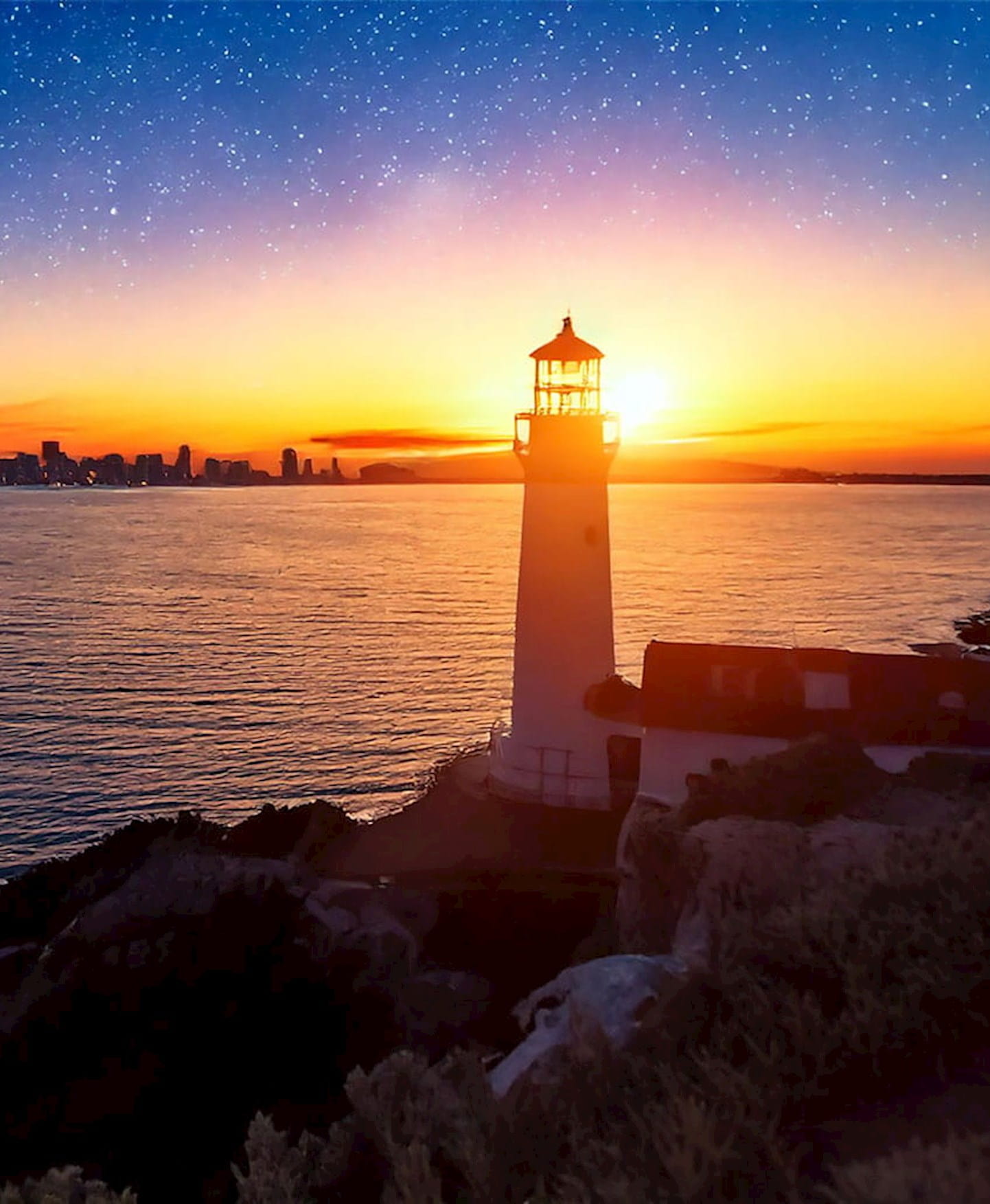 Lighthouse by the sea at dawn