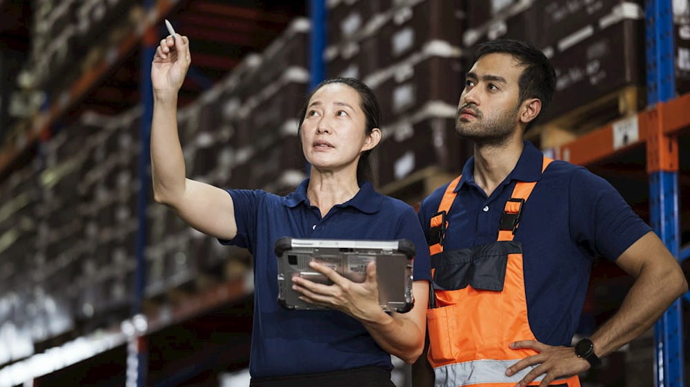 Warehouse workers having a meeting