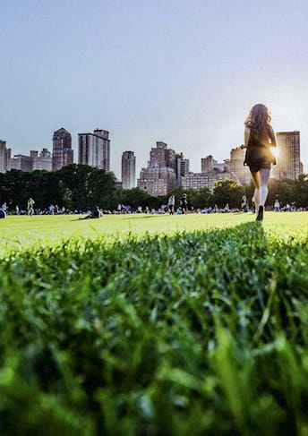 Girl walking in the grass