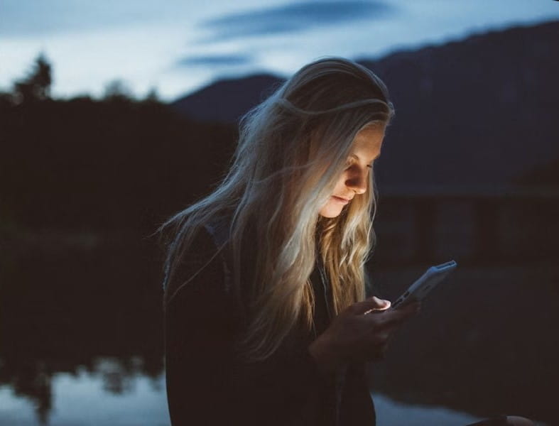 Woman reading from cellphone