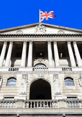 the bank of england building with a british flag