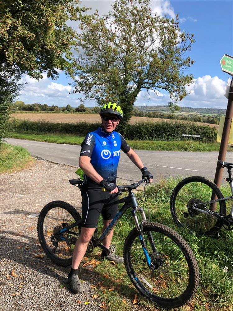 Gareth Lyon in cycling clothing on his bike in the summer