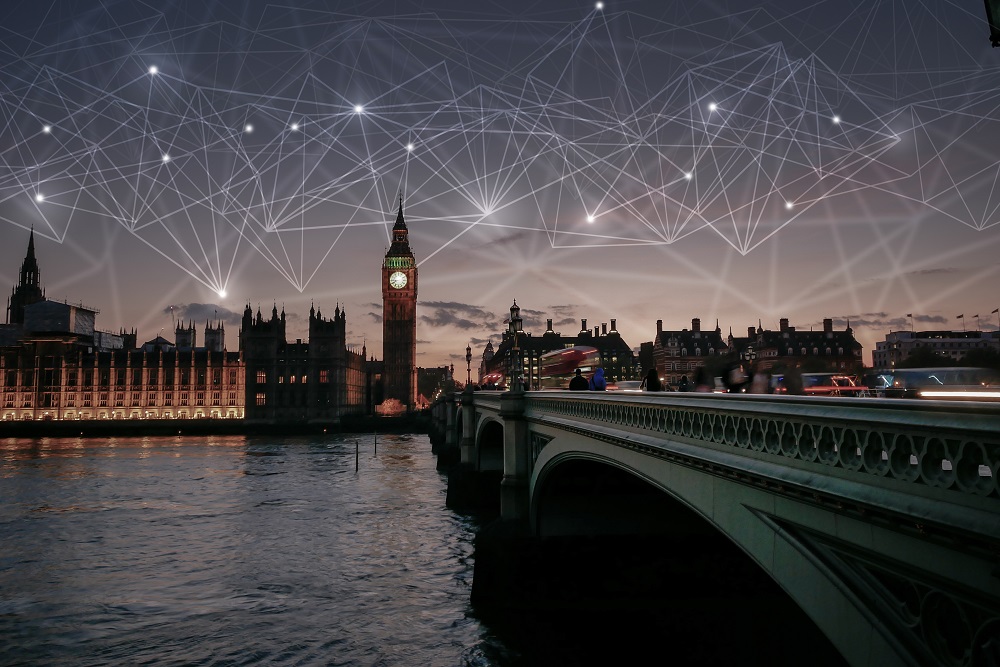 an image of london at dusk with big ben and the river thames in the background