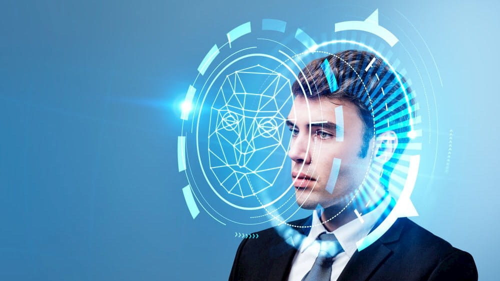 a man's face is shown on a computer screen
