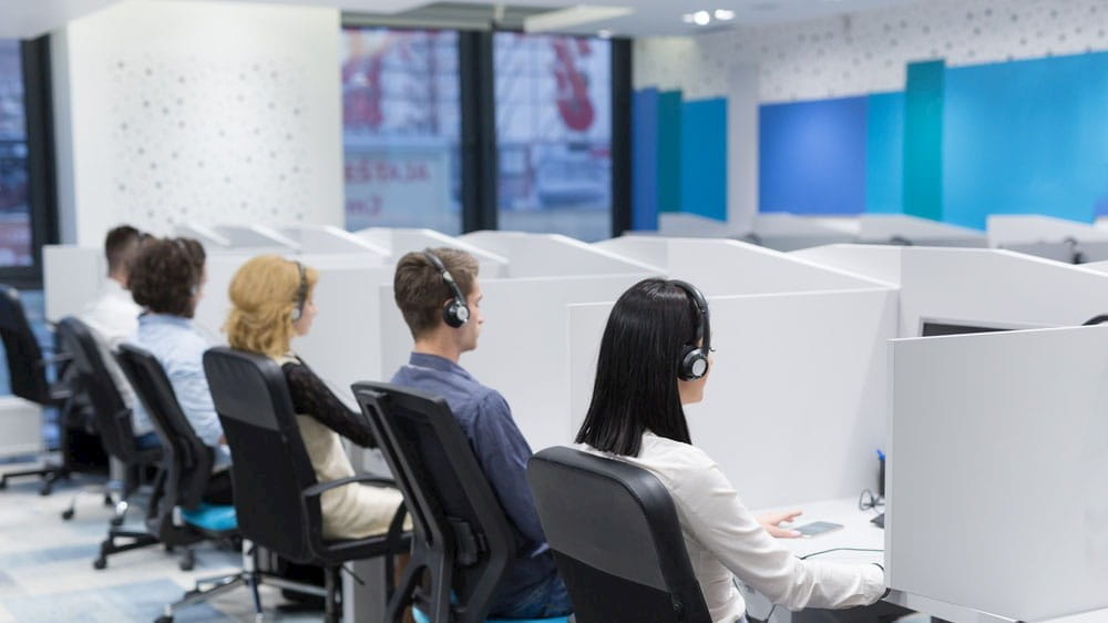 a group of people in a call center