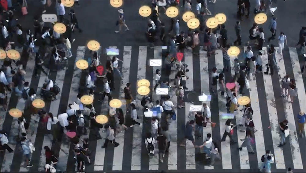 a crowd of people crossing a street in tokyo, japan