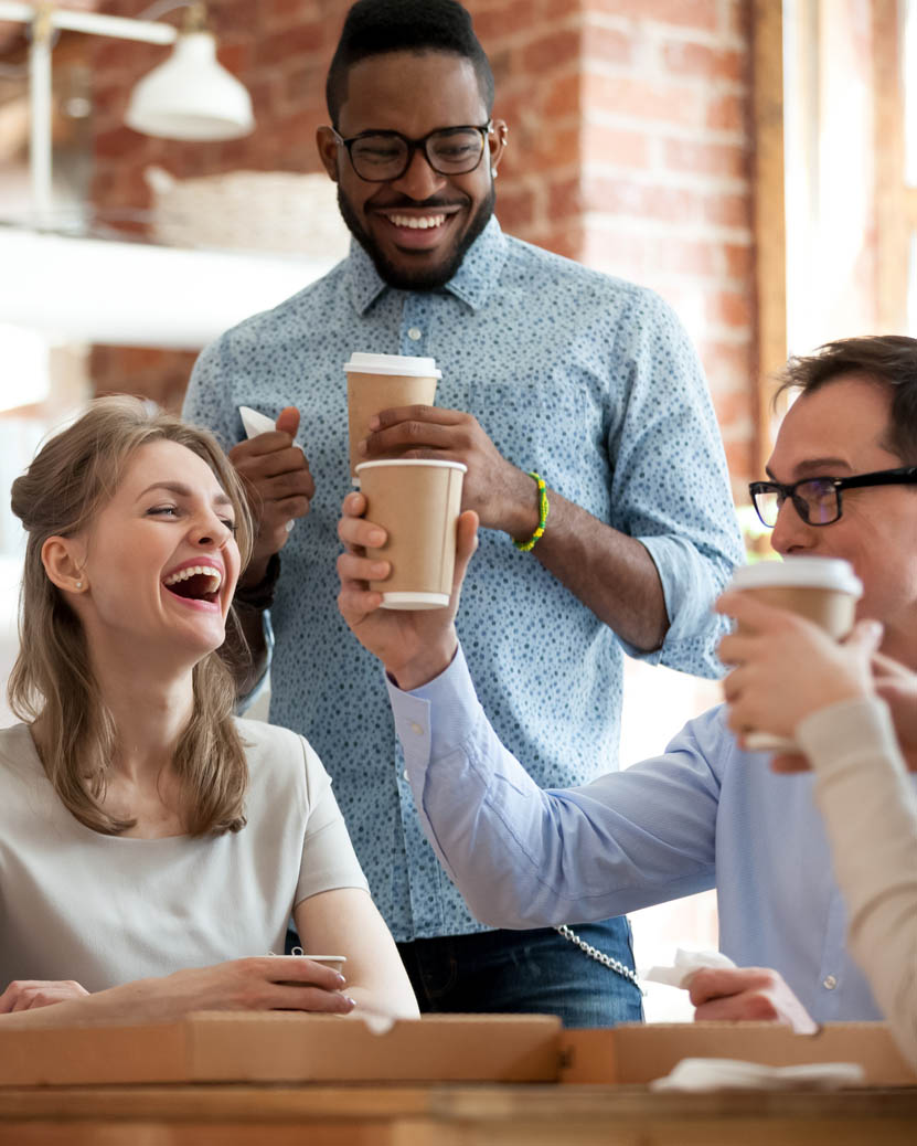 a group of people drinking coffee in a coffee shop