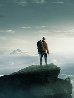 a man standing on top of a mountain