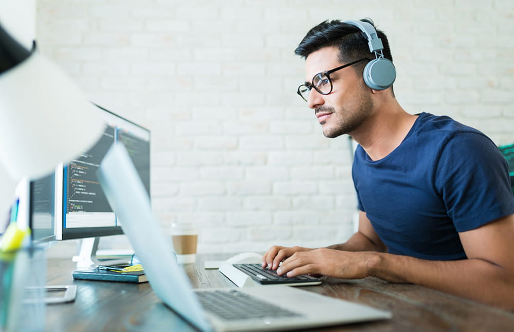Developer working at desk on computer
