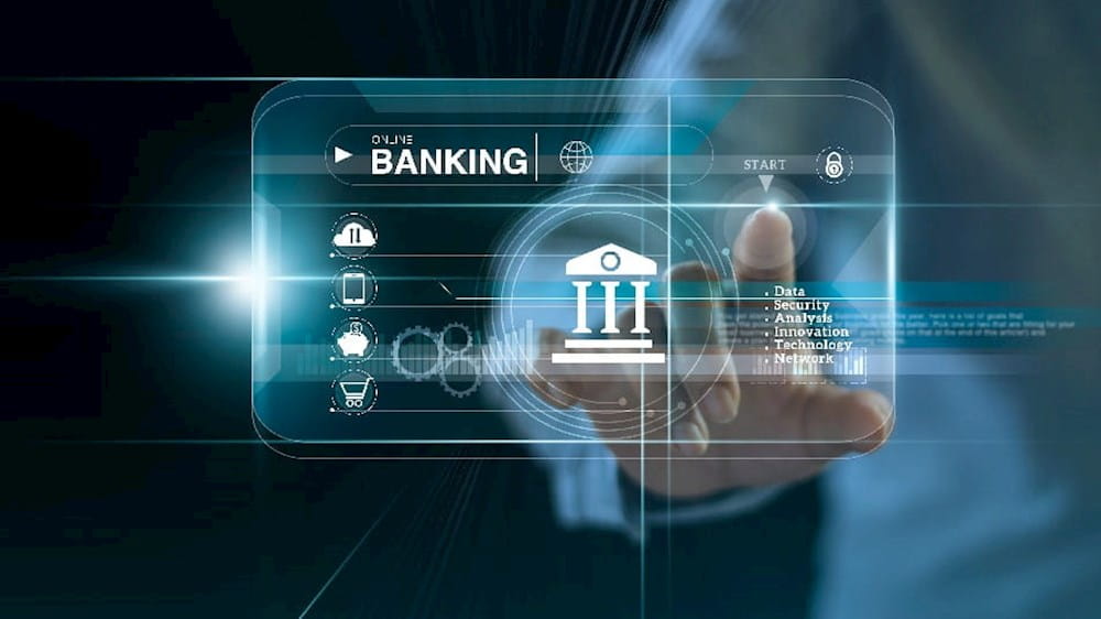 a man is touching a screen with a banking icon on it