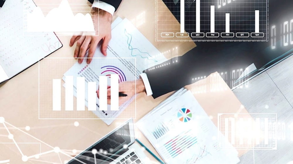 a group of business people looking at graphs on a table